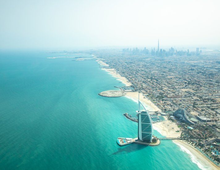 Aerial view of Dubai coast line on a beautiful sunny day.