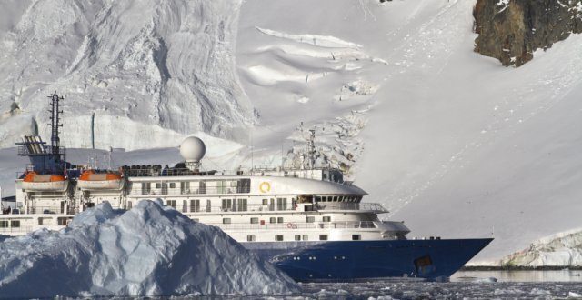 tourist ship on the background of mountains and glaciers of the